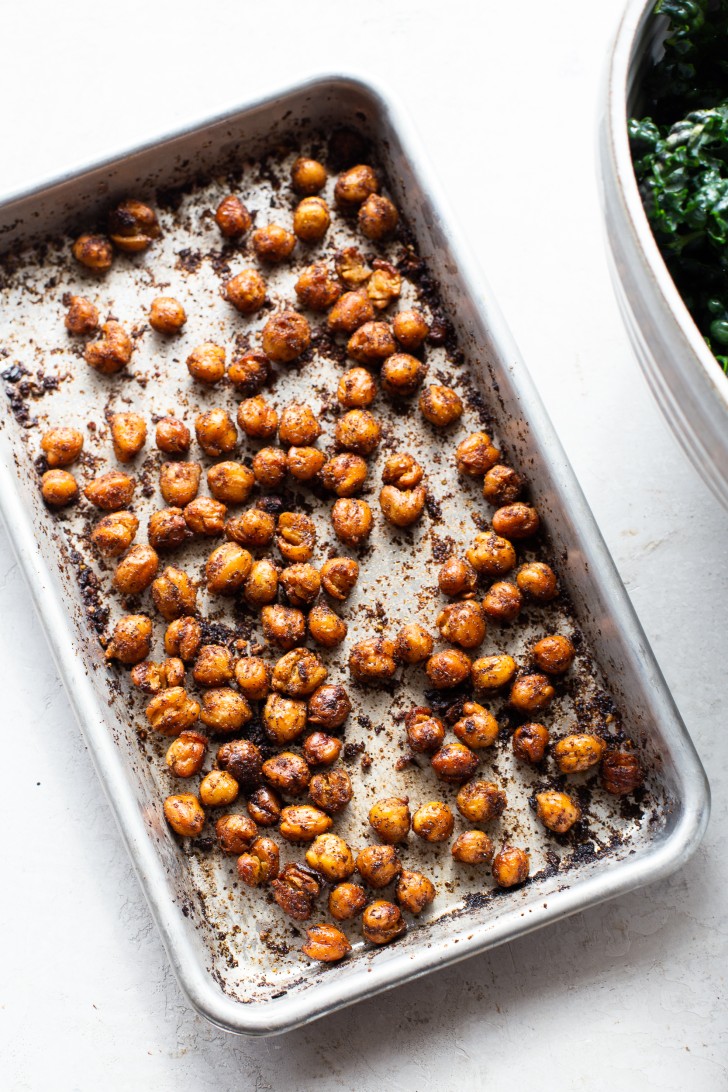Spiced and roasted chickpeas on a baking sheet